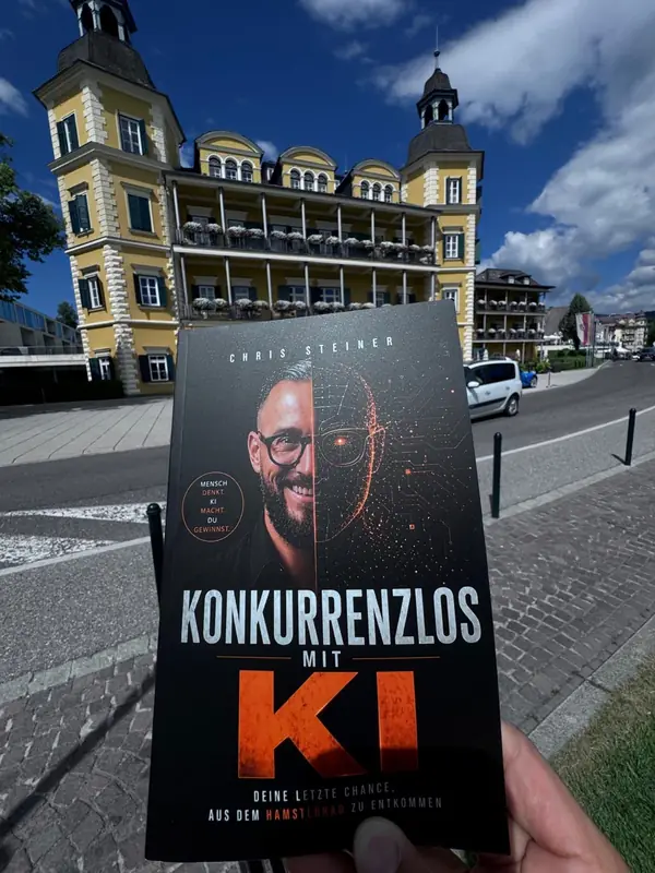 Das Buch „Konkurrenzlos mit KI" liegt aufgeschlagen auf einem Tisch im Hotel.